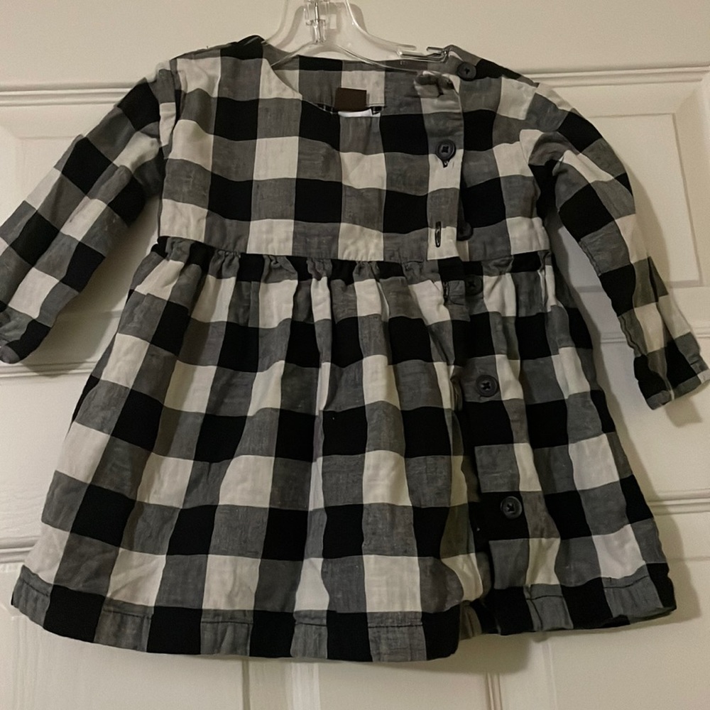 Tea baby girl black and white patterned dress.